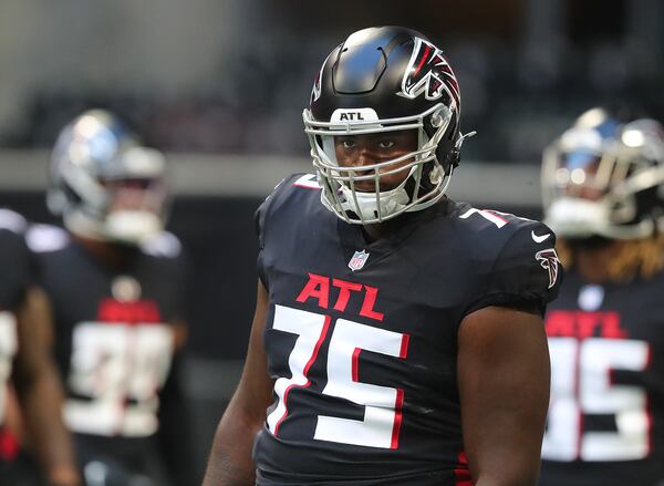 Falcons offensive lineman Kion Smith takes the field against the Tennessee Titans Friday, Aug. 13, 2021, at Mercedes-Benz Stadium in Atlanta. (Curtis Compton / Curtis.Compton@ajc.com)