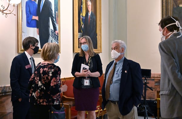 The AJC's Carrie Teegardin (center) has been reporting on shortcomings in Georgia's senior care homes for more than a year. Now major reforms have been signed into law by Gov. Kemp. AJC FILE