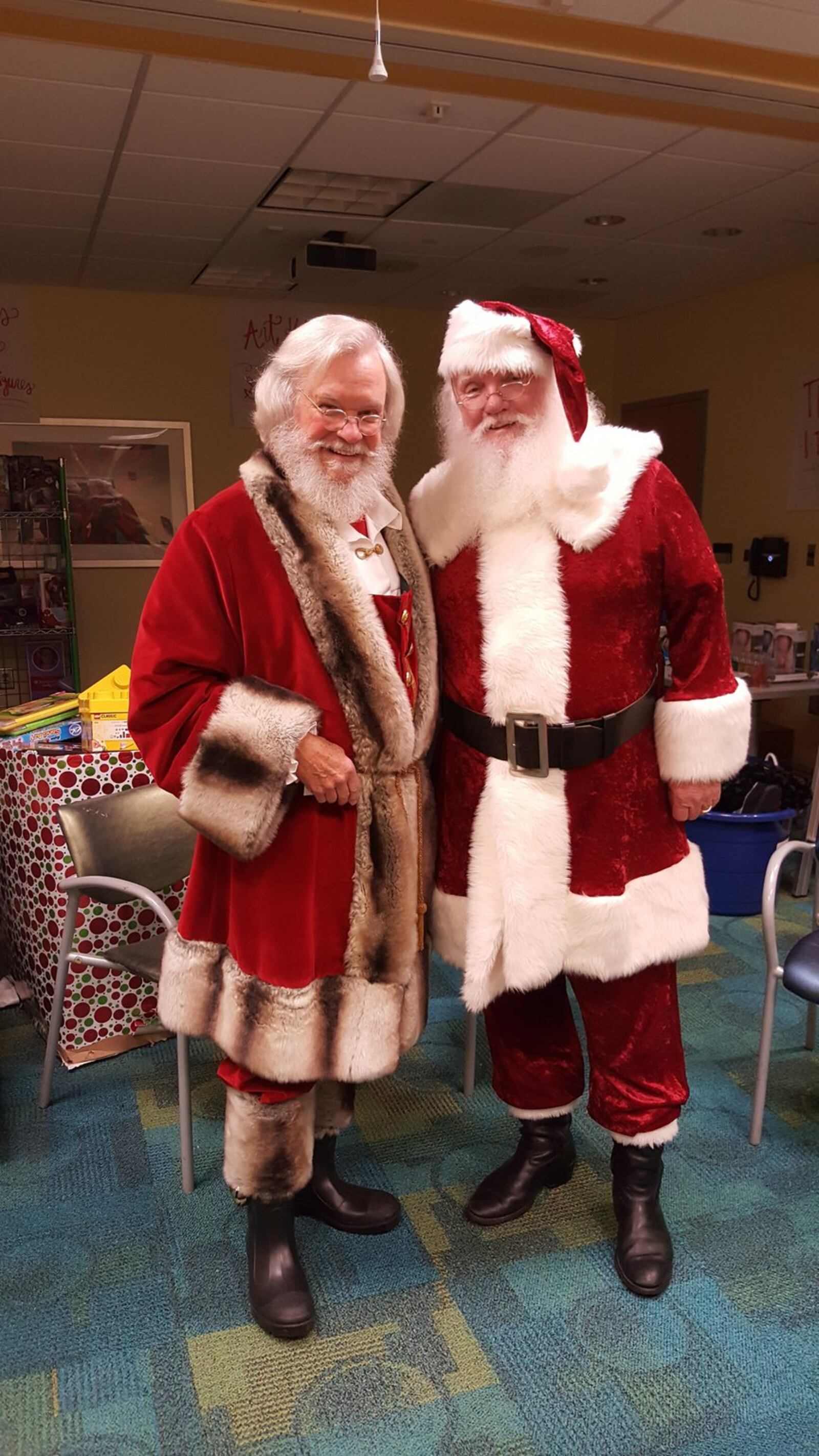 Judge T. Jackson Bedford and Bill Odom embrace the role of Santa every year at Children’s Healthcare of Atlanta at Egleston. CONTRIBUTED