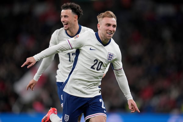 England's Jarrod Bowen celebrates England's Curtis Jones, background, after scoring his side's fourth goal during the UEFA Nations League soccer match between England and the Republic of Ireland at Wembley stadium in London, Sunday, Nov. 17, 2024. (AP Photo/Kin Cheung)