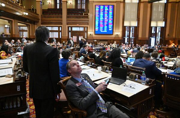 Rep. Bill Werkheiser (R-Glennville), foreground, looks up voting results in the House Chambers at the Georgia State Capitol on Tuesday, March 29, 2022. The Georgia House on Friday passed legislation on a party-line vote that would ban any state or local agency, government or school from requiring anyone to get a COVID-19 vaccination.(Hyosub Shin / Hyosub.Shin@ajc.com)