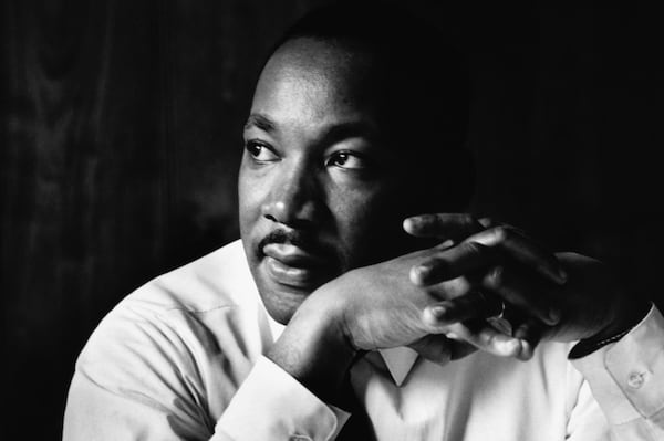 Martin Luther King Jr. listens at a meeting of the Southern Christian Leadership Conference, at a restaurant in Atlanta.