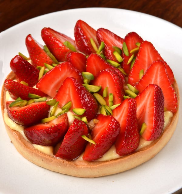 Le Bon Nosh chef Forough Vakili, who went to culinary school in France, loves strawberries, and it shows in her Strawberry Tart. Here, the tart is garnished with toasted chopped pistachios. (Styling by chef Forough Vakili / Chris Hunt for the AJC)