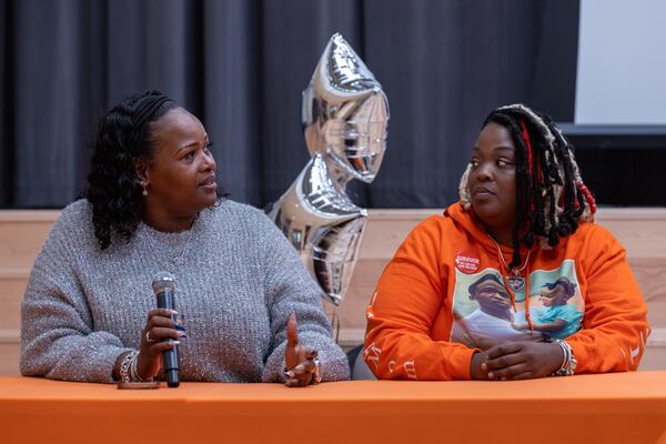 Kim Martin (left) and Paulette Smith speak about their parenting experiences at Friday's forum.