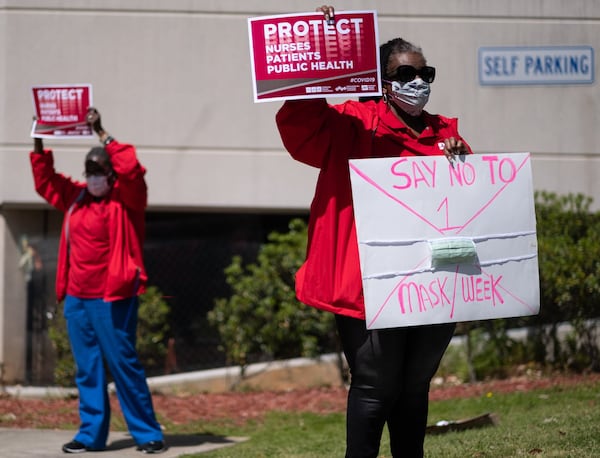 Wearing surgical masks and holding up placards, about a dozen nurses and their supporters staged a protest Friday along Clairmont Road outside the Atlanta VA Medical Center. The group said the VA is rationing masks and protective gear amid a national supply shortage, putting employees’ health at risk by forcing them to reuse the same masks for days or weeks. Ben@BenGray.com for the Atlanta Journal-Constitution