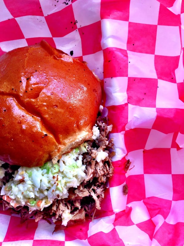 The Carolina’s Finest sandwich is loaded with smoked whole hog, diced slaw, and vinegar sauce on an H&F bun. CONTRIBUTED BY WYATT WILLIAMS