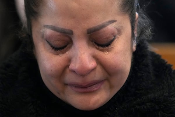 A Syrian Christians woman cries, as she attends the first Sunday Mass since Syrian President Bashar Assad's ouster, at Mariamiya Orthodox Church in old Damascus, Syria, Sunday, Dec. 15, 2024. (AP Photo/Hussein Malla)