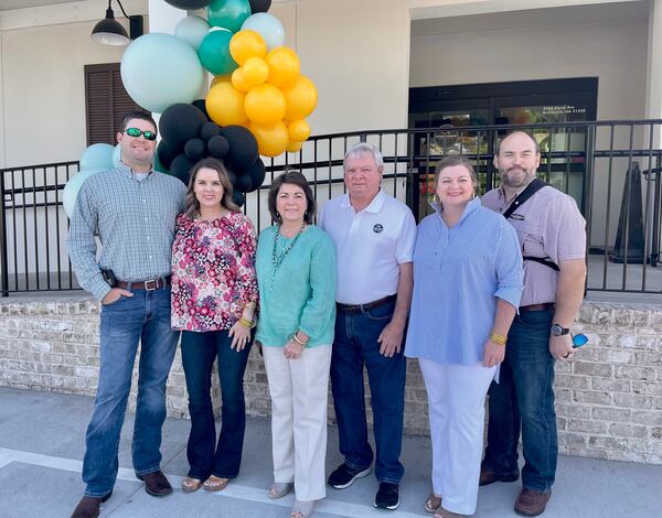 Two generations of the Hardin family still manage Stripling's General Store. From left, Dustin Land, Lindsay Hardin Land, Lisa Hardin, Ricky Hardin, Ashley Hardin Goss and Clint Goss are pictured at the grand opening of the Brunswick store. Courtesy of Stripling’s General Store