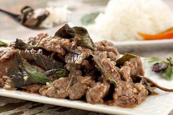 The spicy beef tenderloin stir-fry is flavored with a soy-oyster-fish sauce and finished with lime leaves and holy basil leaves. (Food styling by Lisa Schumacher.)
 (Michael Tercha/Chicago Tribune/TNS)