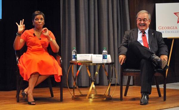 AUGUST 19, 2014 ATLANTA Richard Woods smiles as his opponent, Valarie Wilson, signals OK to the timekeeper during the forum. Democrat Valarie Wilson and Republican Richard L. Woods, the two candidates in the race for state superintendent of schools, participate in a candidate forum at the Georgia Pacific auditorium Tuesday, August 19, 2014. Education issues like Common Core, Race to the Top and school district funding were discussed during the forum as questions were asked from panelists and members of the audience. KENT D. JOHNSON / KDJOHNSON@AJC.COM The two candidates for state school superintendent, Valarie Wilson and Richard Woods, have different takes on how teachers view Common Core. (AJC Photo)