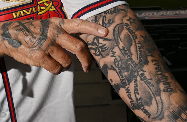 Steve Disney shows off his first tattoo. (Hyosub Shin / Hyosub.Shin@ajc.com)