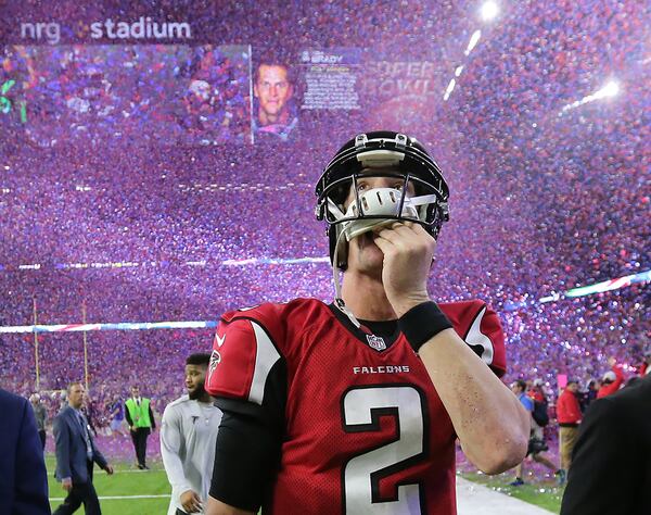 While confetti rains for New England, Falcons quarterback Matt Ryan solemnly exits during his last trip to Houston - the devastating Super Bowl LI loss. (Curtis Compton/ccompton@ajc.com)