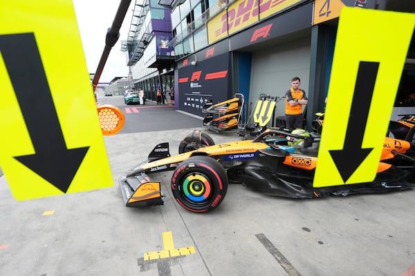 McLaren driver Lando Norris of Britain steers his car out of his team garage during the third practice session at the Australian Formula One Grand Prix at Albert Park, in Melbourne, Australia, Saturday, March 15, 2025. (AP Photo/Scott Barbour)