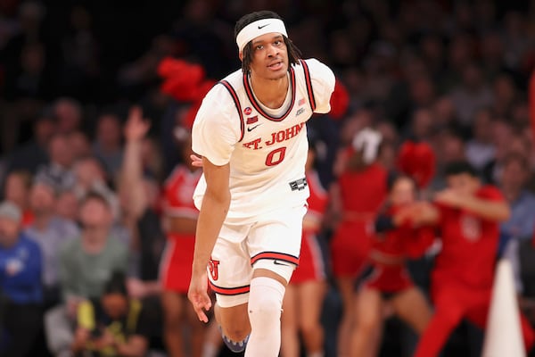 St. John's guard Aaron Scott (0) reacts after scoring a 3-point basket during the second half of an NCAA college basketball game against Butler in the quarterfinals of the Big East Conference tournament, Thursday, March 13, 2025, in New York. (AP Photo/Pamela Smith)