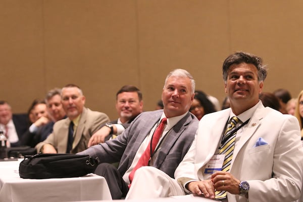 Georgia Revenue Commissioner David Curry, right, and Darrin Satterfield, tax commissioner for Pickens County, attend the Georgia Association of Tax Officials Conference on May 6, 2019 at the Classic Center in Athens, Georgia. CHRISTINA R. MATACOTTA / FOR THE AJC