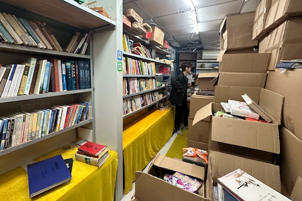 Boxes filled with books are seen inside the shuttered secondhand bookstore Wang Pangzi in Ningbo, in eastern China's Zhejiang province, Oct. 9, 2024. (AP Photo/Dake Kang)