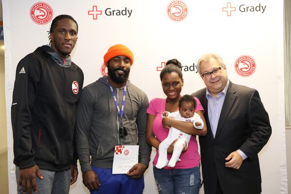 A newborn at Grady is one of the first to receive Atlanta Hawks gear Wednesday. 
PHOTO CREDIT: Neda Perry/Atlanta Hawks