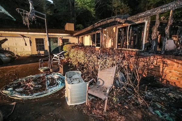 Seven people were inside a home on London Road in Chamblee when it went up in flames on Sunday night. One later died, according to authorities.  