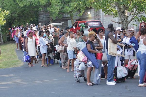 Protesters did not deter crowds lined up to attend the R. Kelly concert at Wolf Creek Amphitheater. on Friday, Aug. 25, 2017. His concert has been overshadowed by new allegations that he kept young women in a “sex cult.”