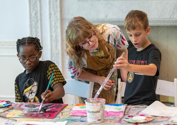 (l-r)  Kevin Jones works on his painting as teacher Ella Kimberly helps William Moravian with his during a summer camp at Callanwolde Fine Arts Center. PHIL SKINNER FOR THE ATLANTA JOURNAL-CONSTITUTION