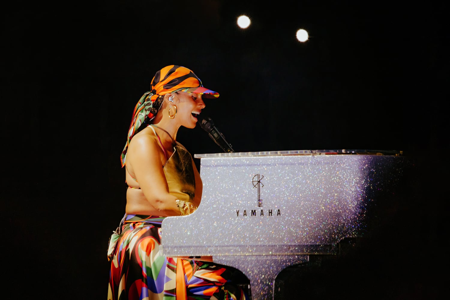 Alicia Keys performs at her glittering piano at State Farm Arena on July 3, 2023. (Sophie Harris for The Atlanta Journal-Constitution).