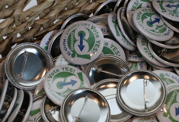 Buttons that encourage people to vote yes for the MARTA referendum, at the Infinite Energy Forum in Duluth on Wednesday, Feb. 20, 2019. EMILY HANEY / emily.haney@ajc.com