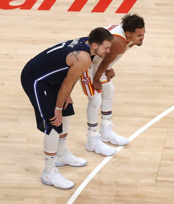 020321 Atlanta: Atlanta Hawks guard Trae Young and Dallas Mavericks guard Luka Doncic chat each other up during an NBA basketball game on Wednesday, Feb 3, 2021, in Atlanta.      Curtis Compton / Curtis.Compton@ajc.com”