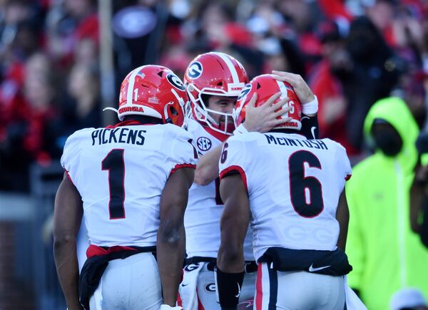 Georgia's running back Kenny McIntosh (6) celebrates with Georgia's quarterback Stetson Bennett (13) after scoring a touchdown during the second half of an NCAA college football game at Georgia Tech's Bobby Dodd Stadium in Atlanta on Saturday, November 27, 2021. Georgia won 45-0 over Georgia Tech. (Hyosub Shin / Hyosub.Shin@ajc.com)