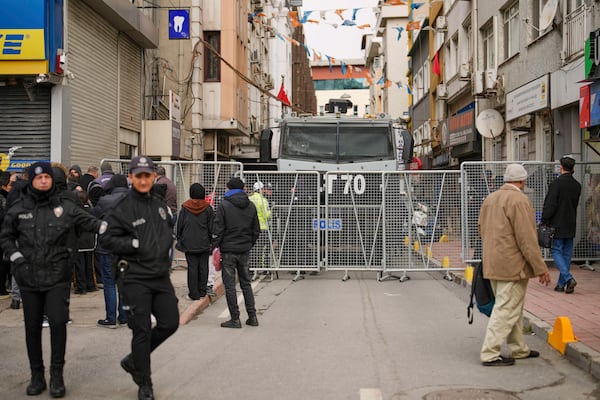 Police cordon off the roads leading to the Vatan Security Department, where Istanbul Mayor Ekrem Imamoglu is expected to be taken following his arrest in Istanbul, Turkey, on Wednesday, March 19, 2025. (AP Photo/Emrah Gurel)