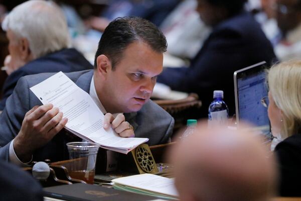 Mar. 22,  2017 - Atlanta -   Rep. Christian Coomer, R - Cartersville, prepares to present his amendment to SB 201, relating to family leave. Both the bill and amendment passed.   Legislative photos from today, the 37th legislative day of the 2017 Georgia General Assembly.   BOB ANDRES  /BANDRES@AJC.COM