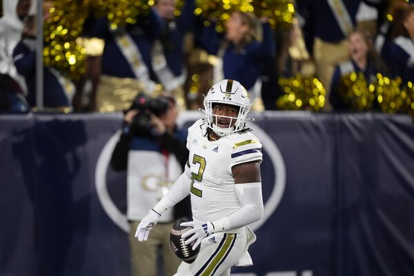 Georgia Tech linebacker E.J. Lightsey (2) celebrates a touchdown after an interception during the first half of an NCAA college football game against North Carolina State, Thursday, Nov. 21, 2024, in Atlanta. (AP Photo/Brynn Anderson)