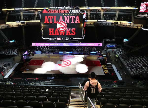 An Atlanta Hawks fan arrives for the game against the Brooklyn Nets  Wednesday, Jan. 27, 2021, in Atlanta. The Hawks will expand seating capacity in the second half of the season. (Curtis Compton / Curtis.Compton@ajc.com)