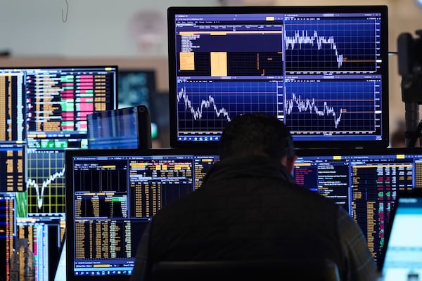 A trader works on the floor of the New York Stock Exchange, Tuesday, March 11, 2025. (AP Photo/Richard Drew)