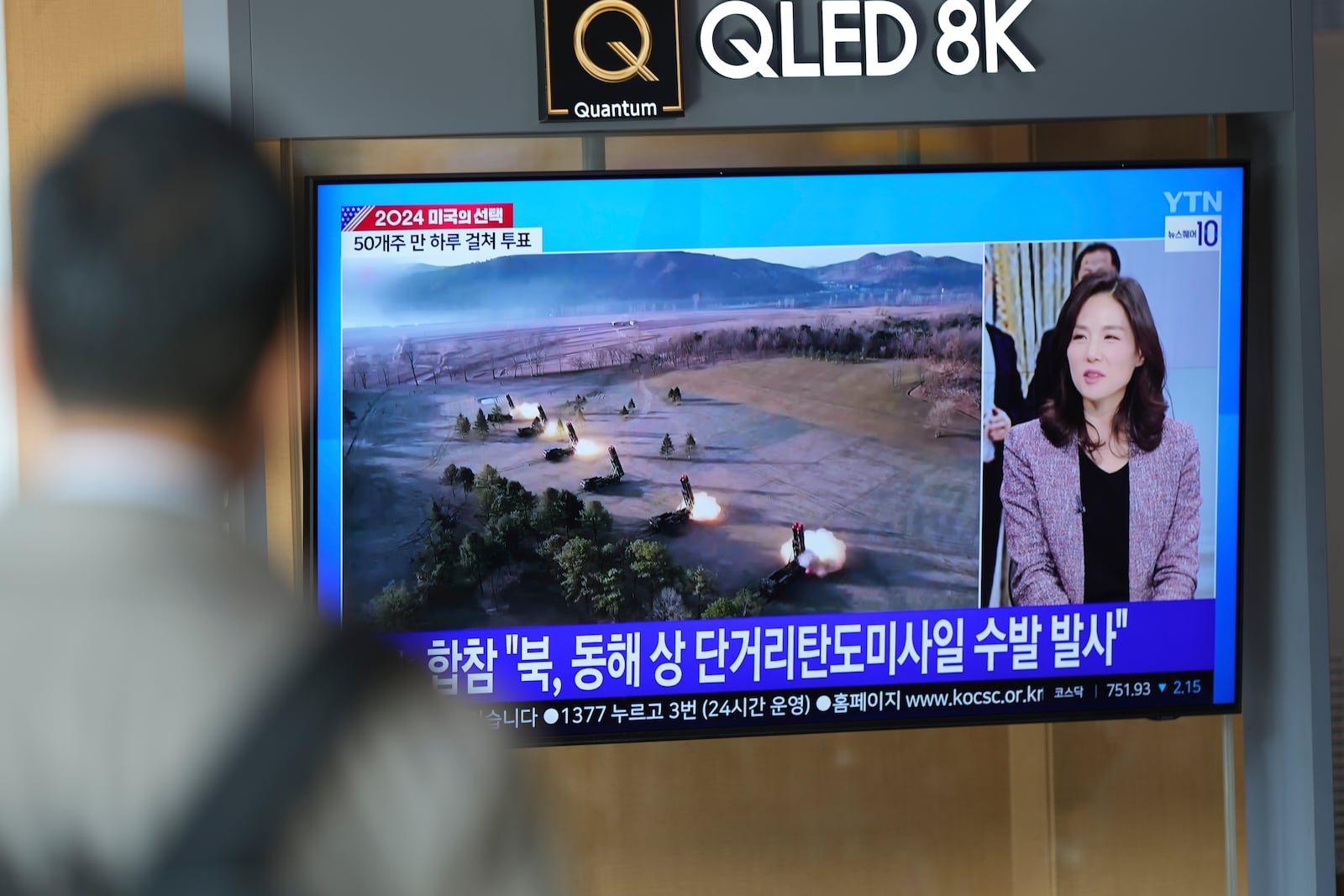 A TV screen shows a report of North Korea's multiple short-range ballistic missiles with file footage during a news program at the Seoul Railway Station in Seoul, South Korea, Tuesday, Nov. 5, 2024. (AP Photo/Lee Jin-man)