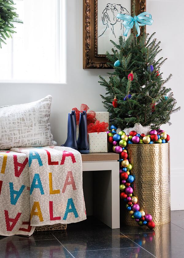 One of the easiest ways to decorate this season is to tie ribbon, whether satin or grosgrain on trees (as shown here in a room designed by Erika Ward), wreaths, on clusters of pinecones and just about anything in your home that could use a little holiday spirit.
(Courtesy of Lauren Chambers)