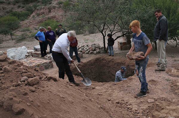 Men dig a mass grave for some of the women and children related to the extended LeBaron family before their burial at a family cemetery in La Mora, Sonora state, Mexico, on Thursday.