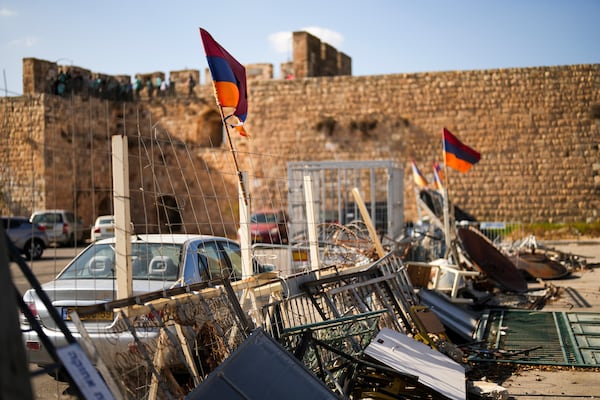 Armenian flags wave in a makeshift barricade set up by local activists in a parking area known as "Cows garden" at the Armenian quarter in Jerusalem, Thursday, Nov. 21, 2024. (AP Photo/Francisco Seco)