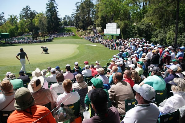 Marc Leishman sets up his putt on the sixth green during the first round of the Masters Tournament Thursday, April 5, 2018, at Augusta National Golf Club. (Jason Getz / For the AJC)