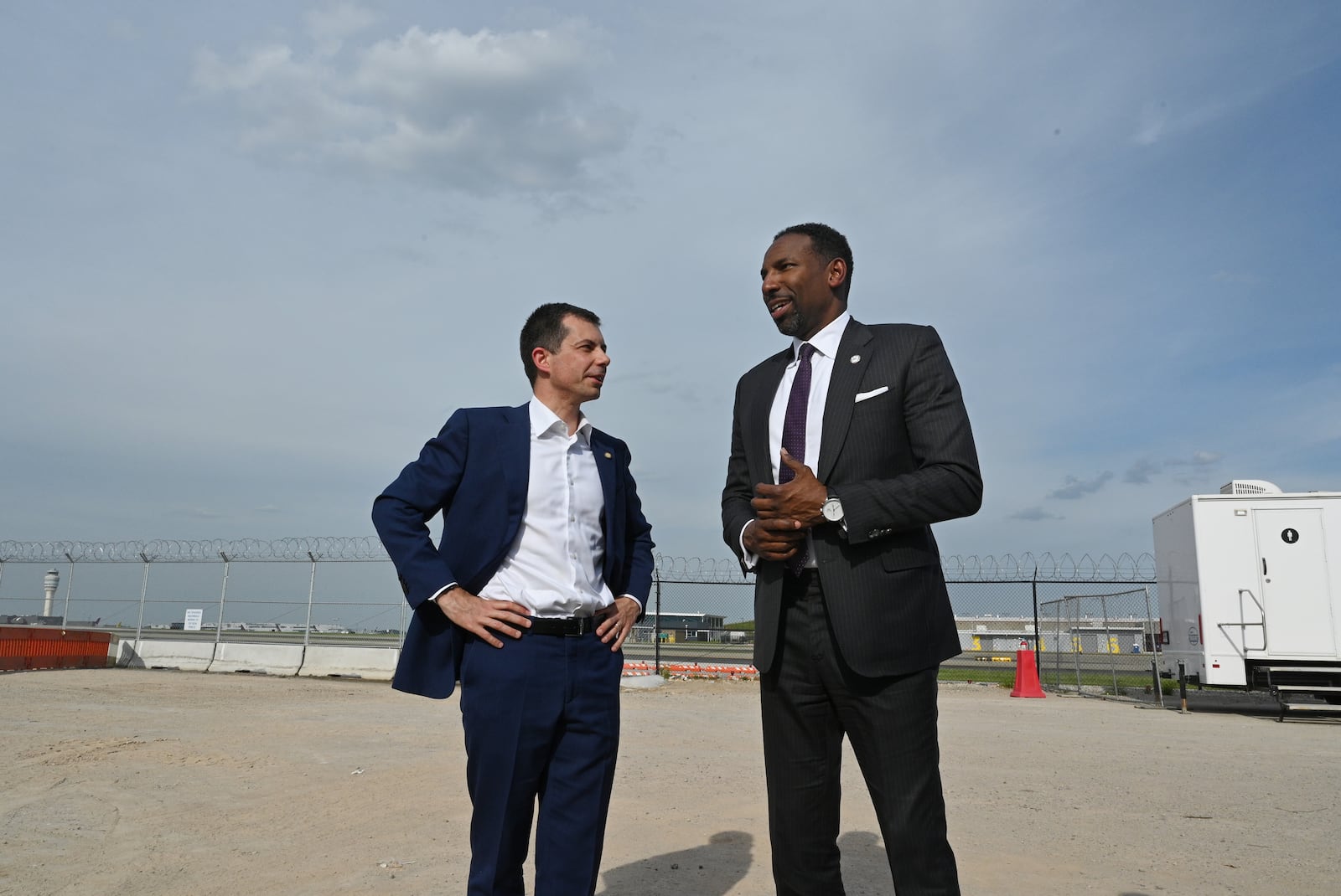 U.S. Transportation Secretary Pete Buttigieg (left) talks with Atlanta Mayor Andre Dickens at Hartsfield-Jackson Atlanta International Airport on Thursday.