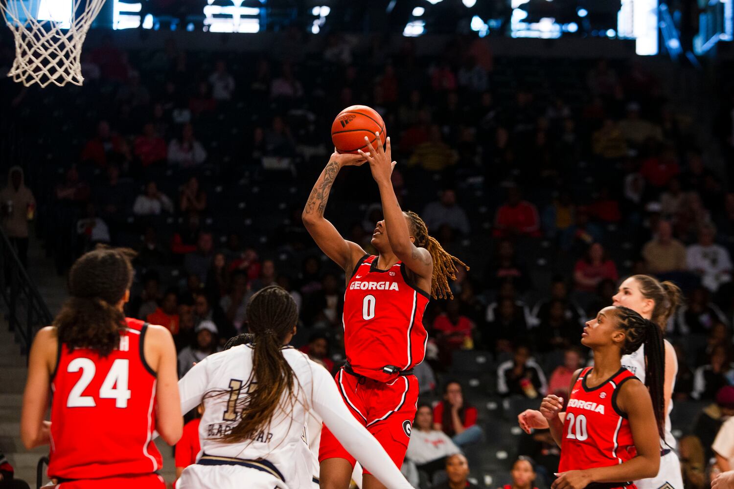 Georgia's Zoesha Smith shoots during a women's basketball game against Georgia Tech on Sunday in Atlanta. (CHRISTINA MATACOTTA / FOR THE ATLANTA JOURNAL-CONSTITUTION)