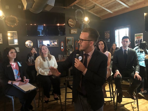 Ted Terry speaks as Sarah Riggs Amico, Teresa Tomlinson and Jon Ossoff at a January 20 forum of Senate Democratic candidates.