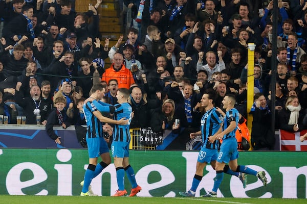 Brugge's Hans Vanaken, left, celebrates with teammates after scoring a penalty his side's first goal, during the Champions League opening phase soccer match between Club Brugge and Aston Villa at Jan Breydelstadion in Bruges, Belgium, Wednesday, Nov. 6, 2024. (AP Photo/Geert Vanden Wijngaert)