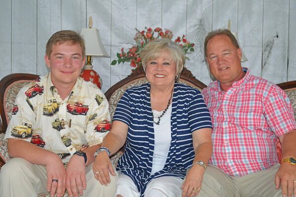 Sherry Clements Wilmot, center, with her son, J.T., and husband, Kurt, who got the Johnson & Johnson vaccine in the spring. Sherry says, "Kurt felt strongly that I should also get the vaccine, but he didn’t argue with me. He told me ‘I know that you’ve had some trouble with medications in the past, and I know you’re scared,’ but every now and then he would gently say, ‘I think you’ll be fine if you got it.’" (Courtesy of Sherry Clements Wilmot)