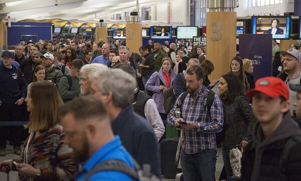 Multiple security lines at Hartsfield-Jackson International Airport ran across the atrium then snaked through baggage claim in both domestic terminals on Monday February 4th, 2019. Official expected over 100,00 travelers to pass through the airport today. (Photo by Phil Skinner)