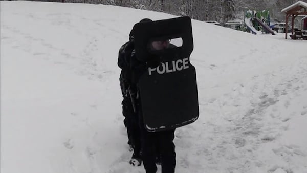 Police in Washington took part in a snowball battle, but brought in some defenses for the fight.