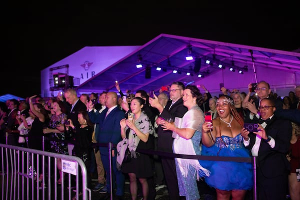 Delta Air Lines celebrates its 100-year anniversary on Saturday, March 15, 2025, at the Delta Flight Museum. More than 1,200 people were expected to attend. After formal remarks, the crowd went outside for the unveiling of a new plane livery. (Jenni Girtman for The Atlanta Journal-Constitution)