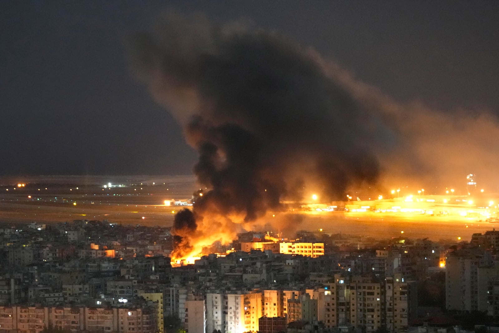 Flames and smoke rise form an Israeli airstrike on Dahiyeh, in the southern suburb of Beirut, Lebanon, Sunday, Oct. 20, 2024. (AP Photo/Hussein Malla)