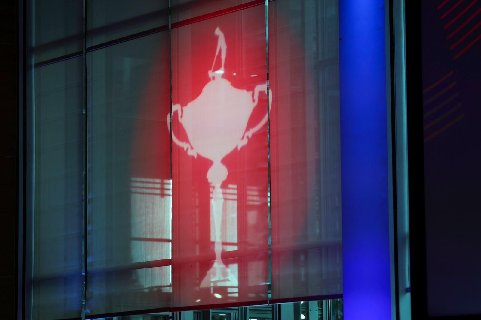 The Ryder Cup golf trophy is projected during a captains press conference in New York, Tuesday, Oct. 8, 2024. (AP Photo/Heather Khalifa)