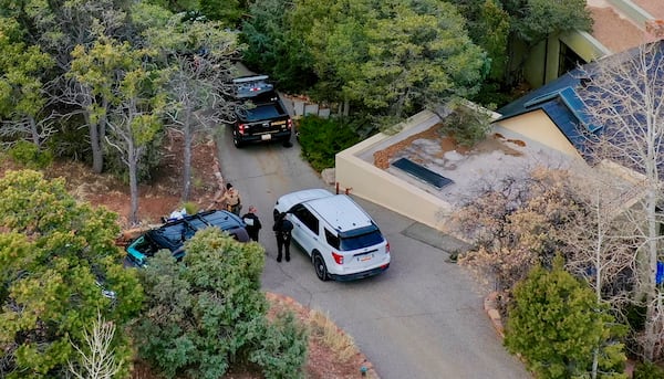 Santa Fe County deputies remain outside the house belonging to actor Gene Hackman and his wife Betsy Arakawa were earlier found dead, Thursday, Feb. 27, 2025 in Santa Fe, N.M. (AP Photo/Roberto E. Rosales)