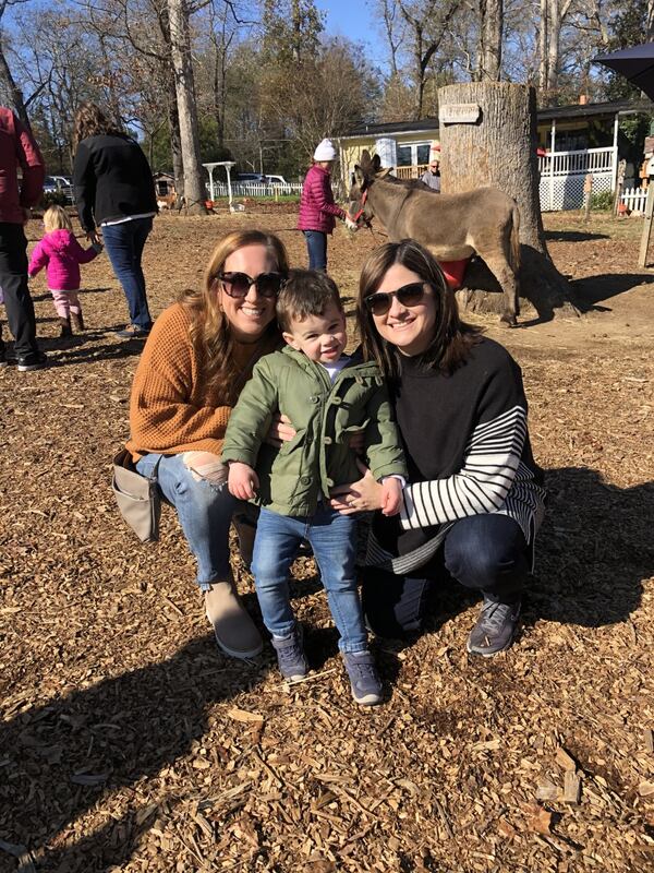 Cooper McKamey smiles at his 3rd birthday alongside his mom, Besty McKamey (right), and his aunt, Jessica Cooper (left), who was was his gestational carrier. Courtesy of Betsy McKamey